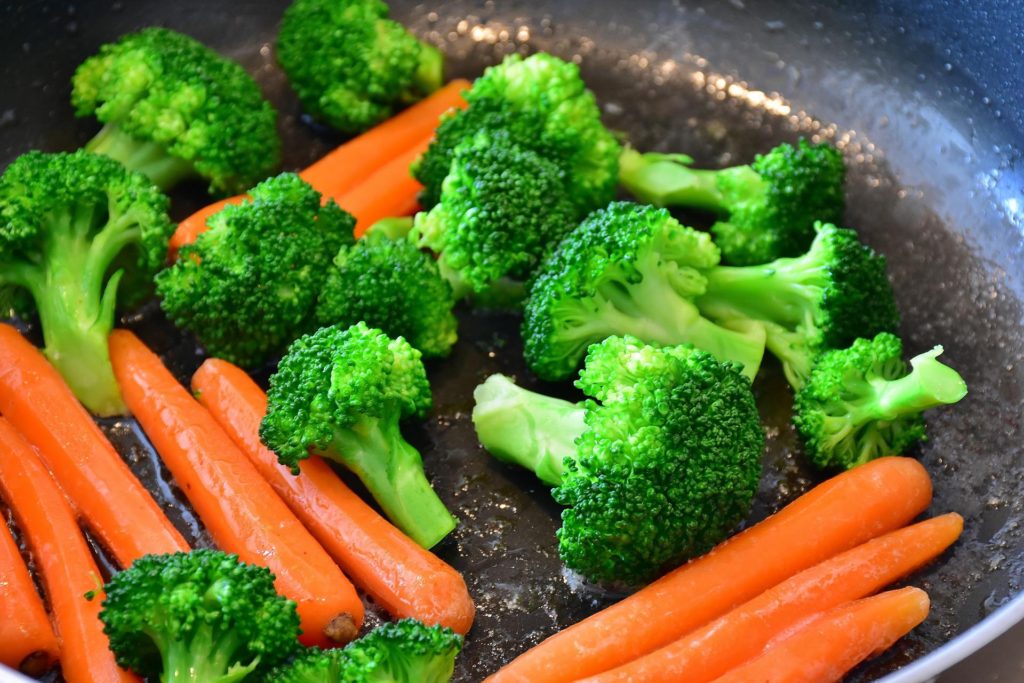 Broccoli and carrots sauteed quickly with minimal liquid preserves vitamins.