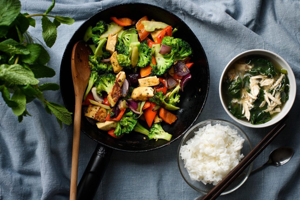 Plant-based plate with stir fry with soup and white rice