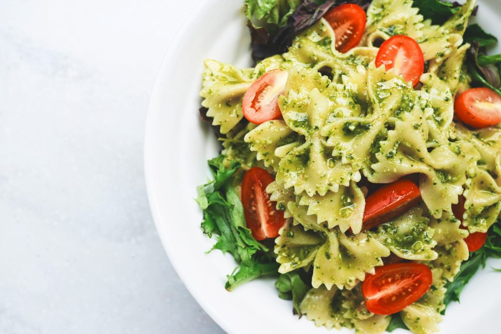 Pasta can provide carbs before a workout. 