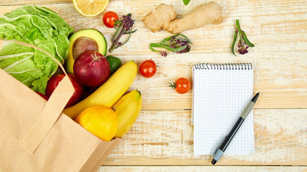 Produce and tablet on a table | Bring Dinner Back